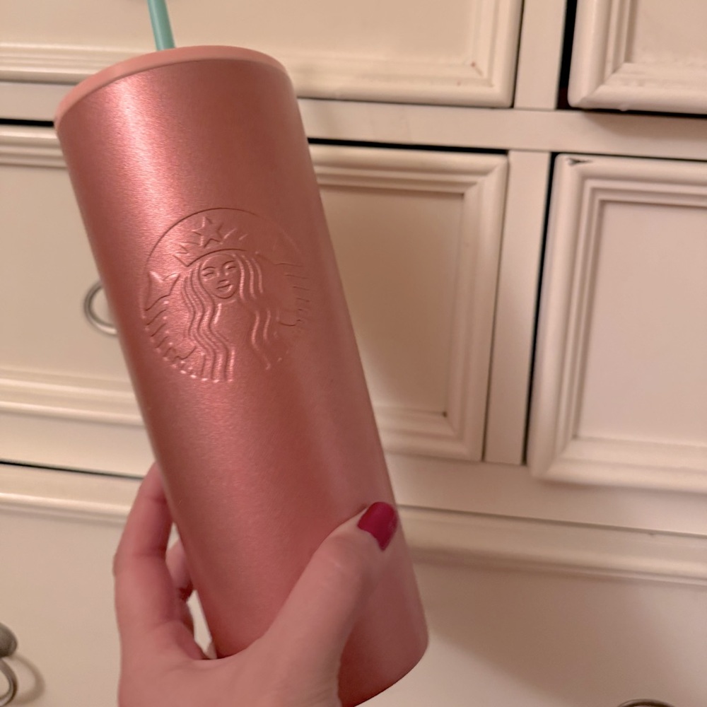Starbucks tumblr insulated. Actually keeps drinks cool.